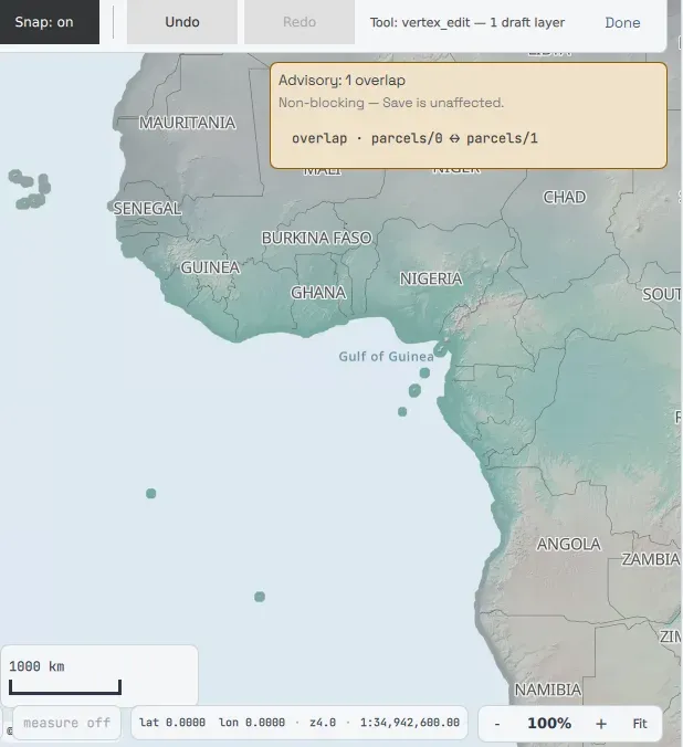 The map surface mid-edit, with a non-blocking advisory panel reading "Advisory: 1 overlap, Non-blocking — Save is unaffected" and naming the two overlapping parcel features.